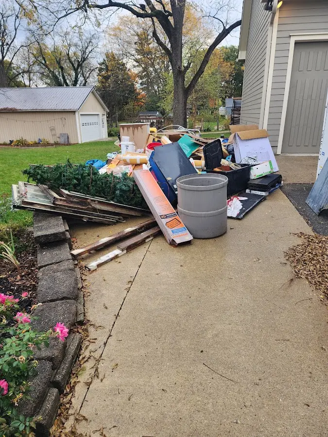 Dumpster being loaded with debris for Roofing Dumpster Rental in Bolivar Peninsula